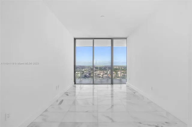 a bathroom with a granite countertop sink toilet a mirror and shower