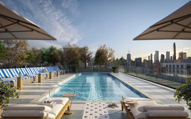 swimming pool view with a seating space