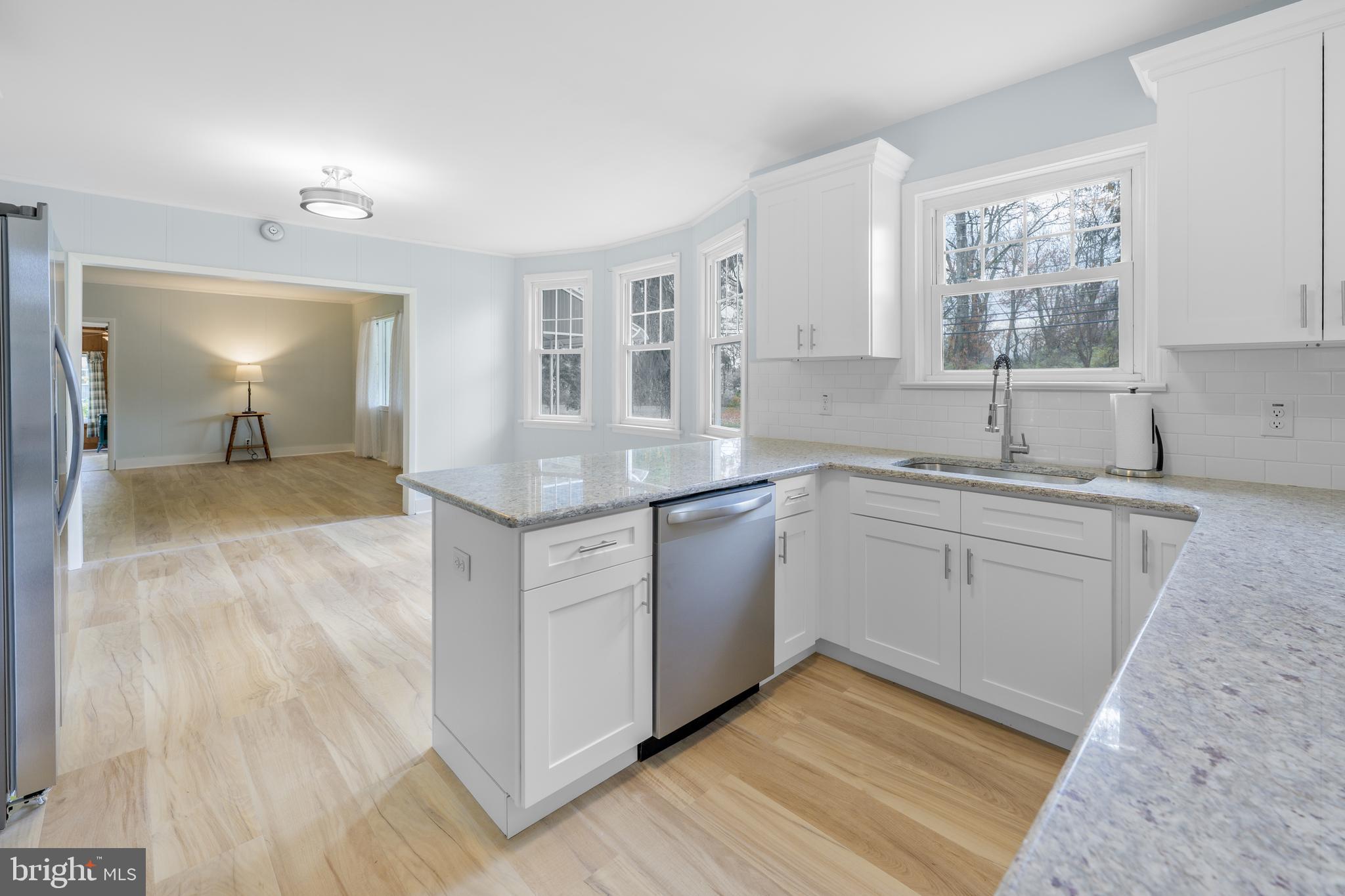107 Hartford Road Mount Laurel, NJ 08054 - Photo 5 of 29 a kitchen with a sink cabinets appliances and a window