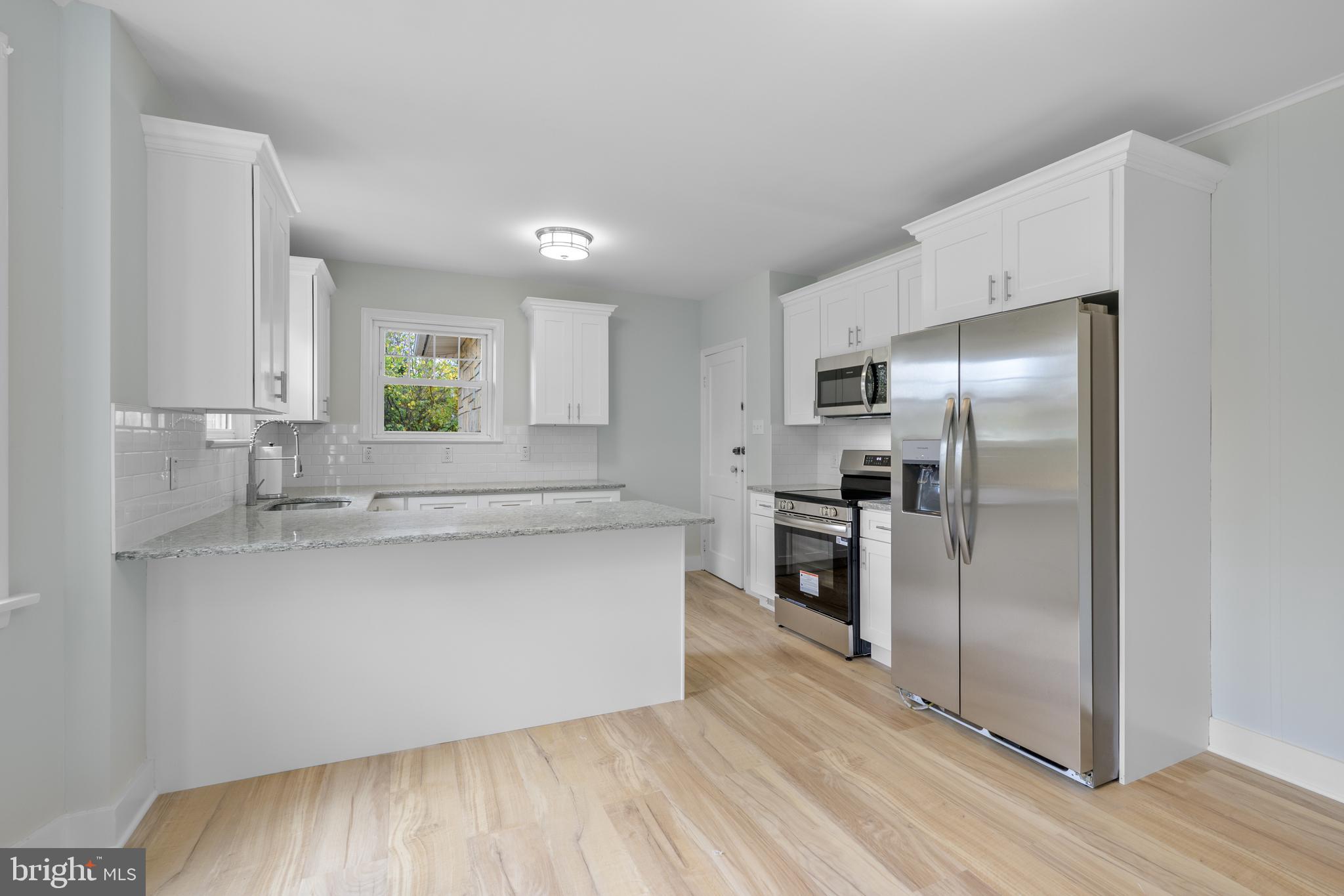 107 Hartford Road Mount Laurel, NJ 08054 - Photo 8 of 29 a kitchen with stainless steel appliances a refrigerator and a sink