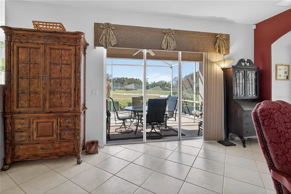 a view of a dining room with furniture window and outside view