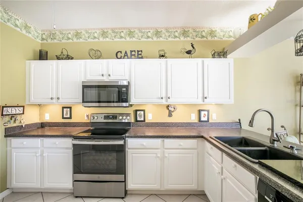 a kitchen with a refrigerator and a cabinets