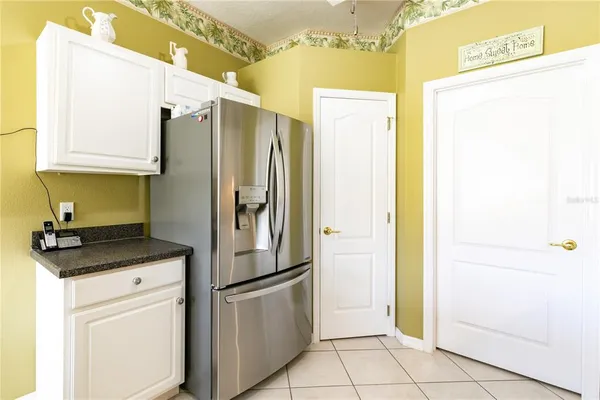 a kitchen with a stove a sink and a refrigerator