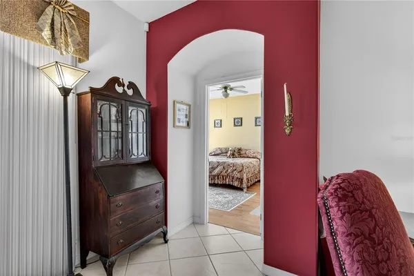 a bed room with a bed and a chair