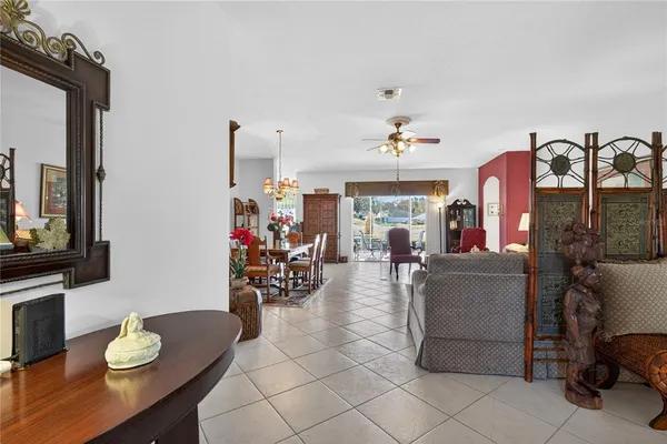 a view of a dining room with furniture wooden floor and chandelier