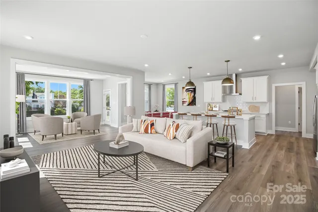 a living room with furniture and a table