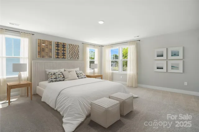 a bedroom with a large bed and a window