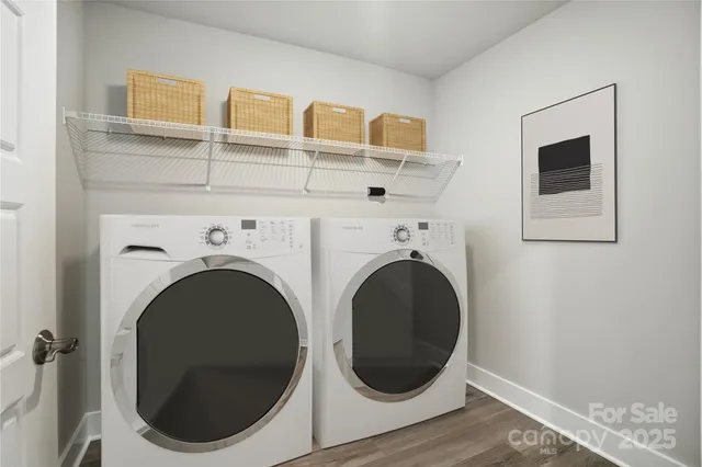 a close view of a utility room with dryer and washer