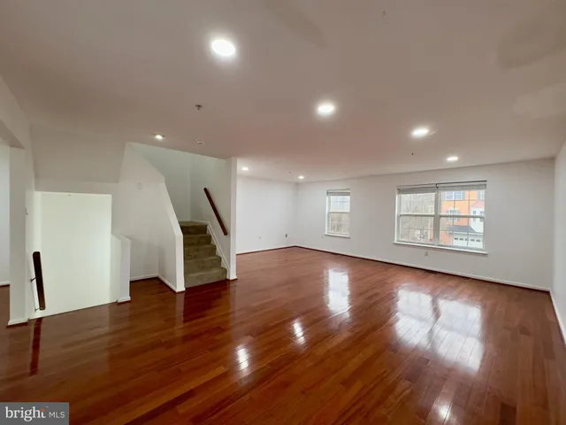 a view of a hallway with washer and dryer