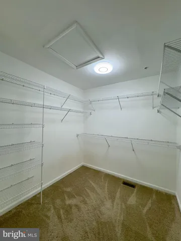 a bathroom with a double vanity sink and mirror
