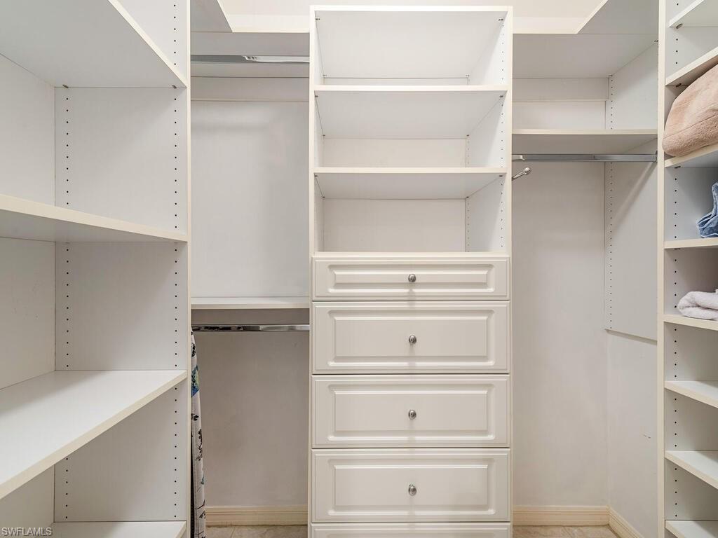 809 Augusta Boulevard, Unit 8092 Naples, FL 34113 - Photo 8 of 12 a view of walk in closet with empty racks