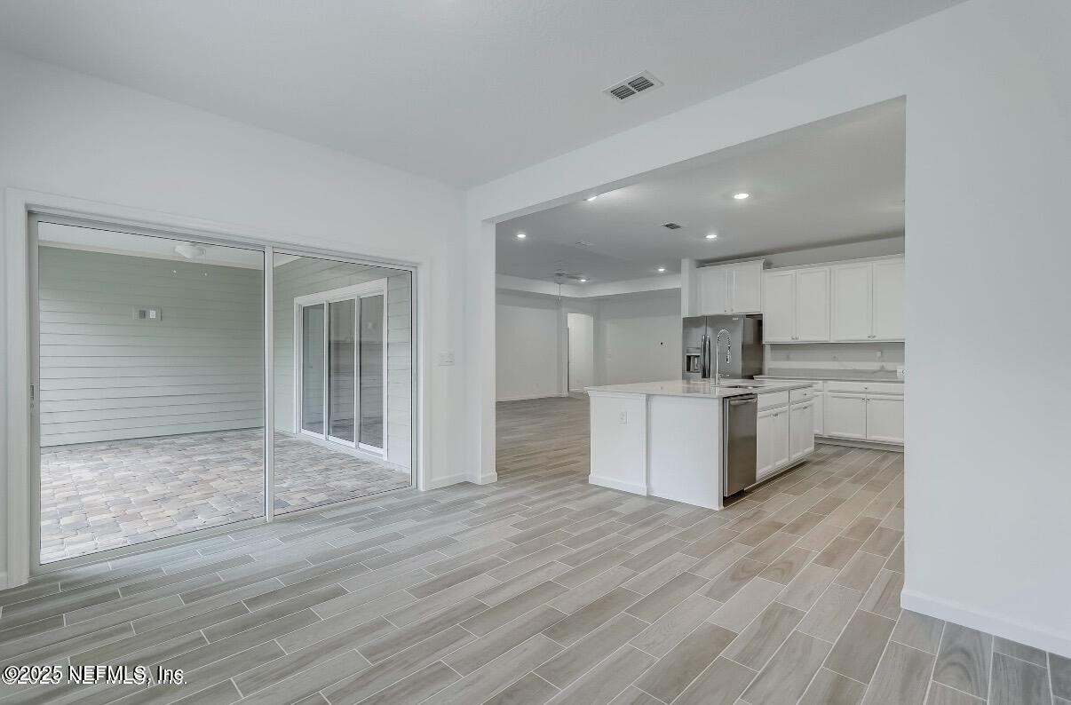 300 Gan Way St. Johns, FL 32259 - Photo 17 of 36 a view of kitchen with cabinets and wooden floor