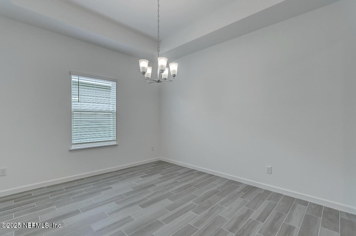 300 Gan Way St. Johns, FL 32259 - Photo 20 of 36 wooden floor in an empty room with a window