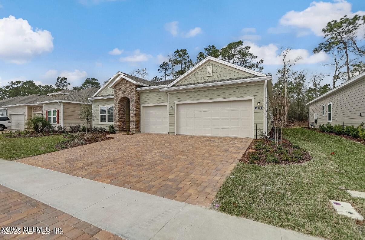300 Gan Way St. Johns, FL 32259 - Photo 2 of 36 front view of a house with a yard