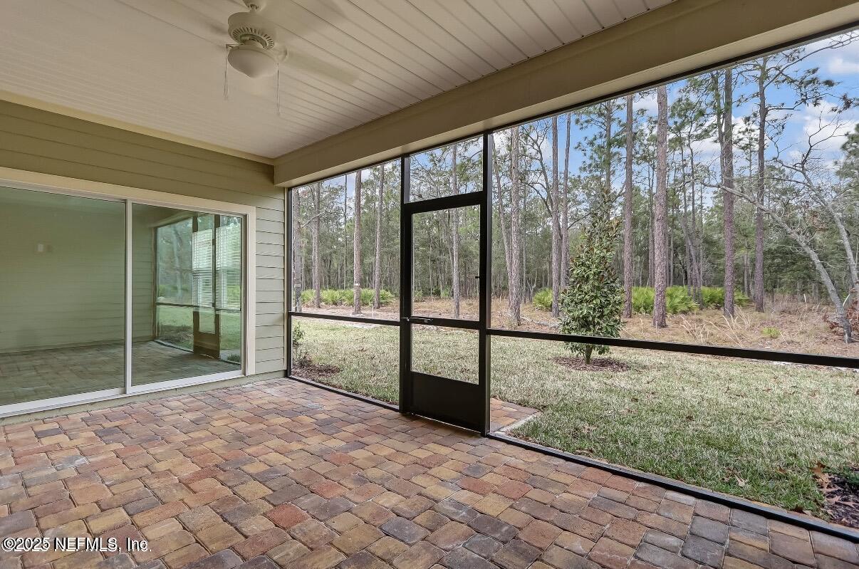 300 Gan Way St. Johns, FL 32259 - Photo 35 of 36 a view of a room with sliding glass door and mountain view