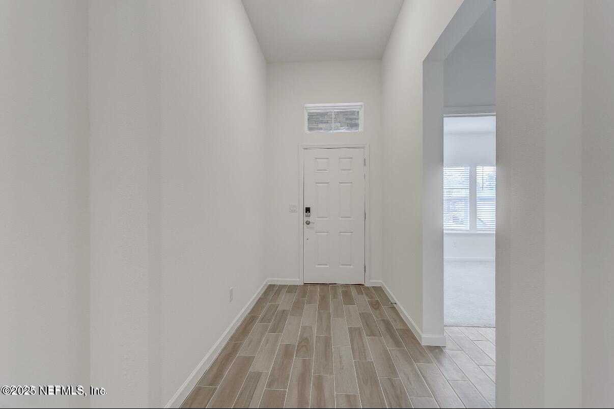 300 Gan Way St. Johns, FL 32259 - Photo 6 of 36 a view of a room with wooden floor and a window