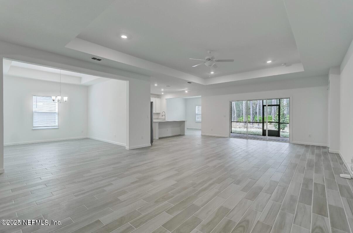 300 Gan Way St. Johns, FL 32259 - Photo 8 of 36 a view of an empty room with wooden floor and a window