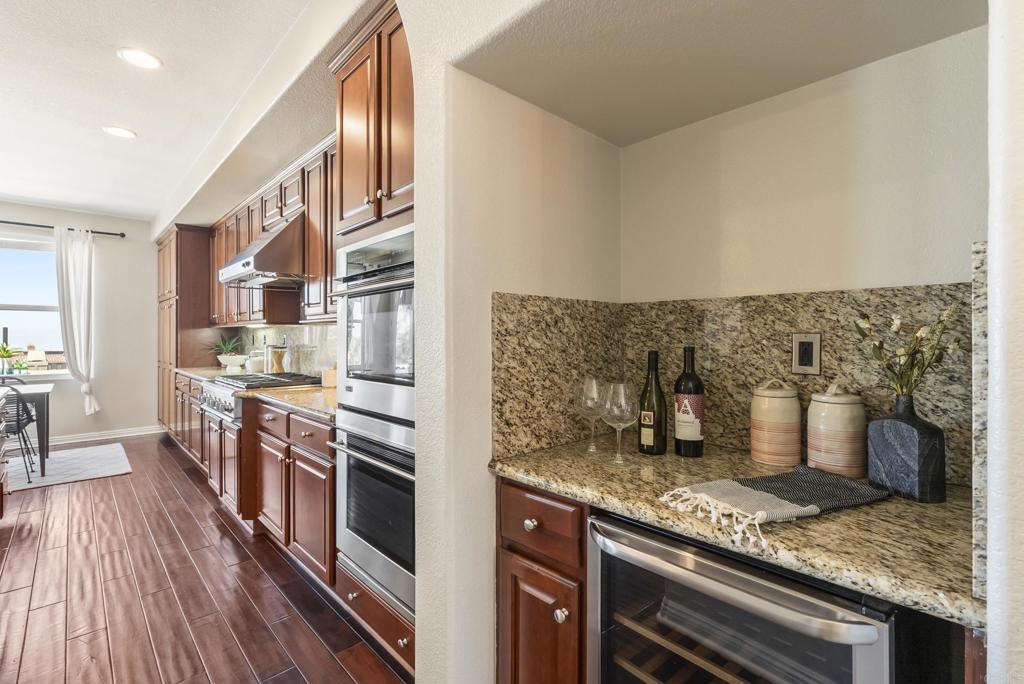1407 Eclipse Drive San Marcos, CA 92078 - Photo 12 of 32 a kitchen with a stove and cabinets
