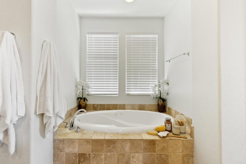 1407 Eclipse Drive San Marcos, CA 92078 - Photo 16 of 32 a bath tub sitting in a bathroom next to a window