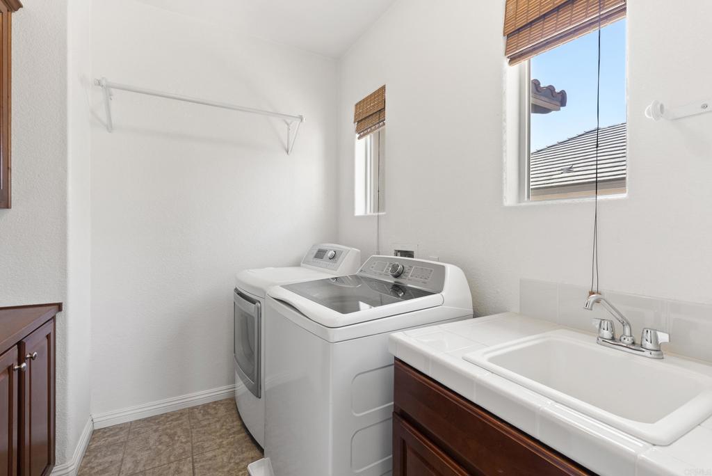 1407 Eclipse Drive San Marcos, CA 92078 - Photo 22 of 32 a bathroom with a sink and a mirror