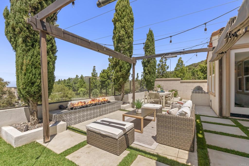 1407 Eclipse Drive San Marcos, CA 92078 - Photo 28 of 32 a view of a patio with couches table chairs and potted plants