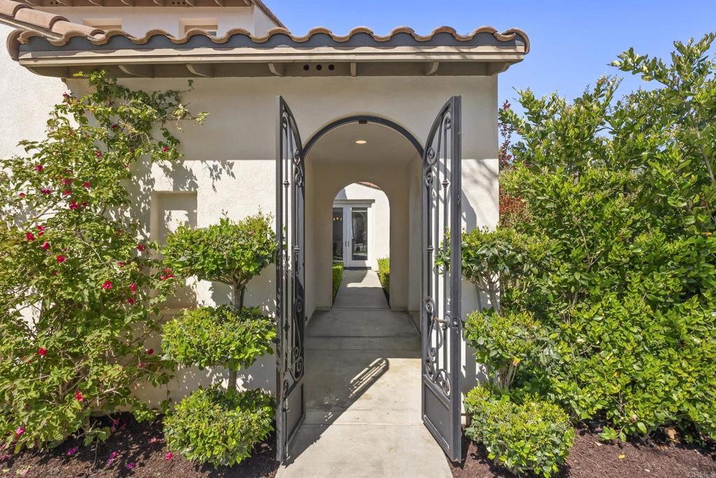 1407 Eclipse Drive San Marcos, CA 92078 - Photo 3 of 32 a front view of a house with lots of green space