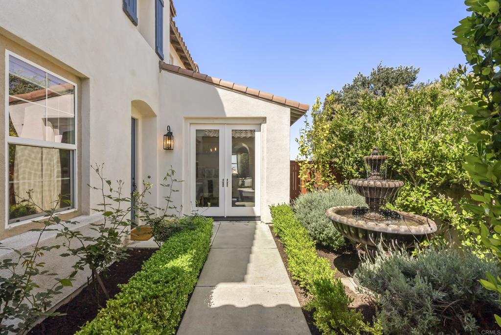 1407 Eclipse Drive San Marcos, CA 92078 - Photo 4 of 32 a front view of a house with a yard