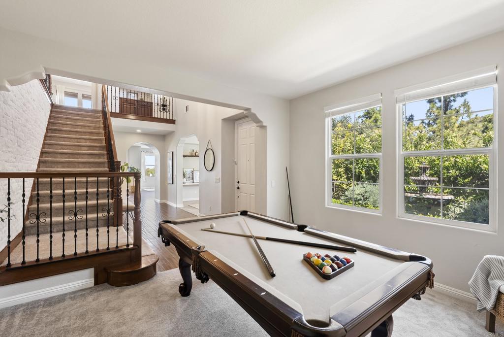 1407 Eclipse Drive San Marcos, CA 92078 - Photo 7 of 32 a living room with pool table and windows