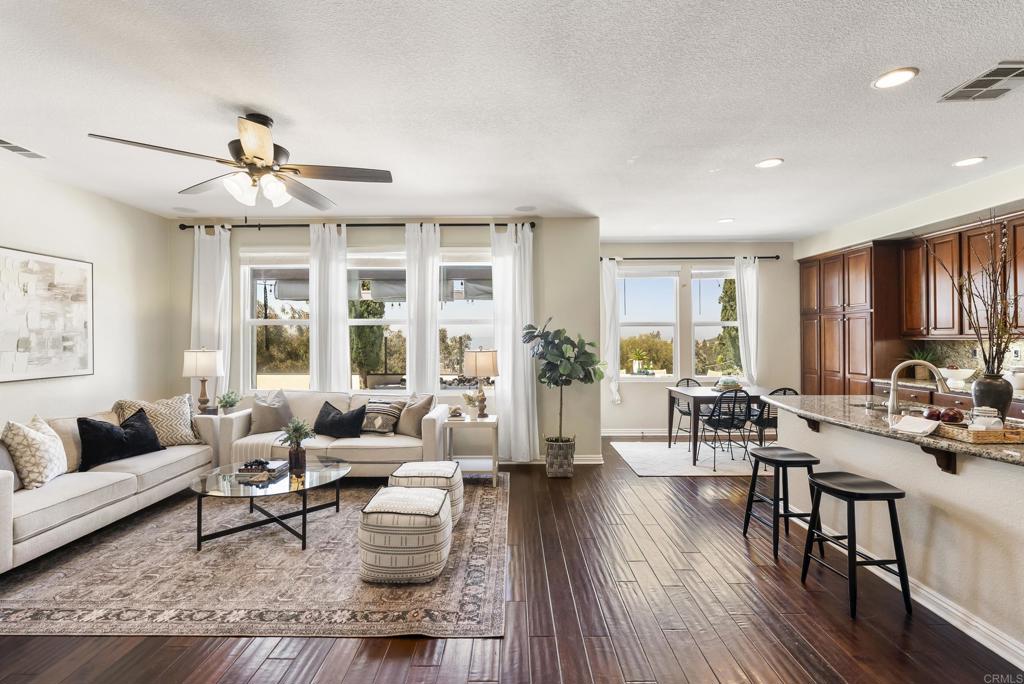 1407 Eclipse Drive San Marcos, CA 92078 - Photo 8 of 32 a living room with furniture and a large window