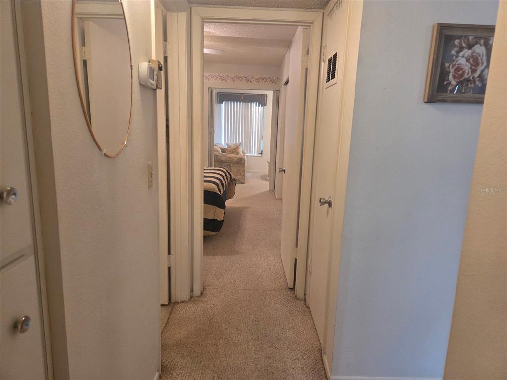 2386 Sumatran Way, Unit 14 Clearwater, FL 33763 - Photo 12 of 71 a view of a bathroom from a hallway