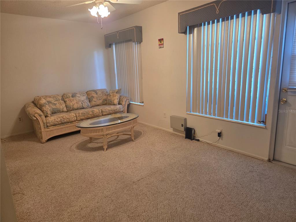 2386 Sumatran Way, Unit 14 Clearwater, FL 33763 - Photo 16 of 71 a living room with furniture and a window