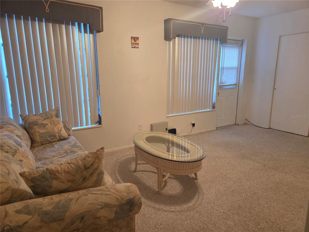 2386 Sumatran Way, Unit 14 Clearwater, FL 33763 - Photo 17 of 71 a living room with furniture and a window
