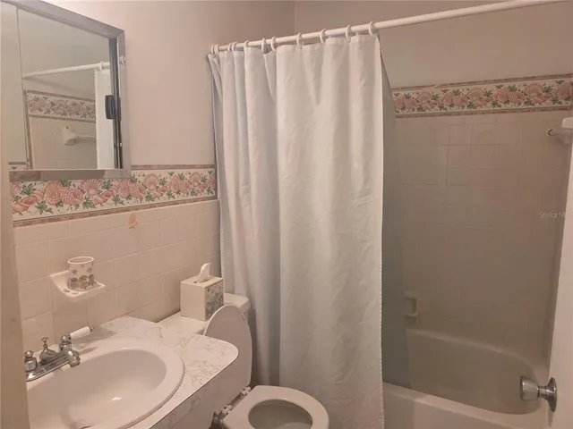 a view of a swimming pool with a yard