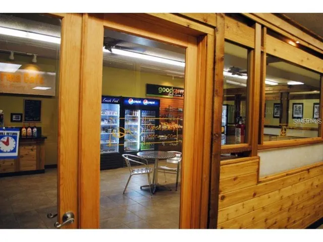 a view of a lake with table and chairs