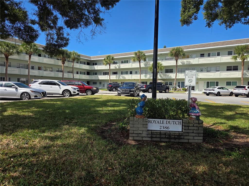 2386 Sumatran Way, Unit 14 Clearwater, FL 33763 - Photo 4 of 71 a view of a building with a big yard