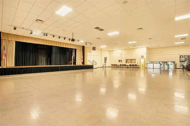 a kitchen with lots of table and chairs