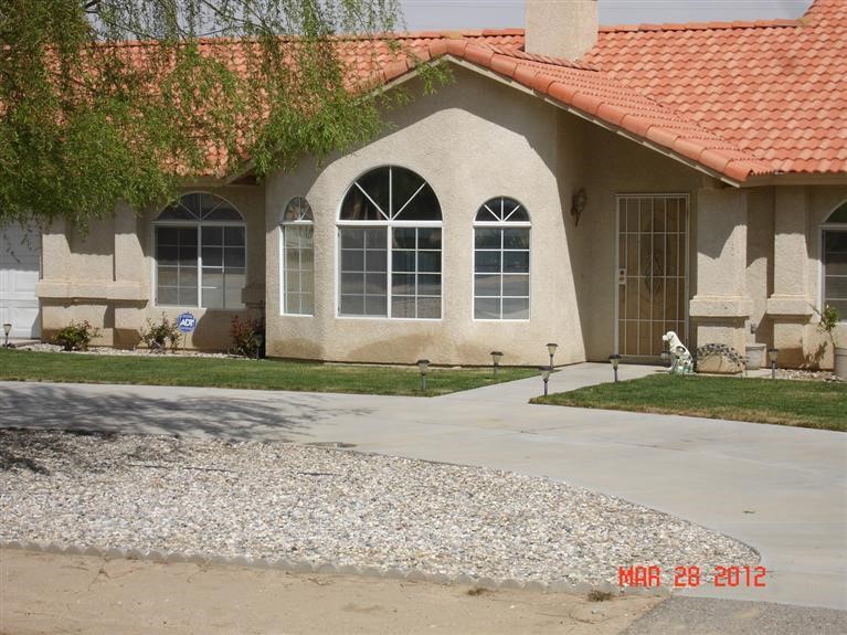 19220 Osceola Road Apple Valley, CA 92307 - Photo 1 of 1 a view of a brick house with a yard