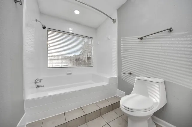 a bathroom with a sink toilet and bathtub