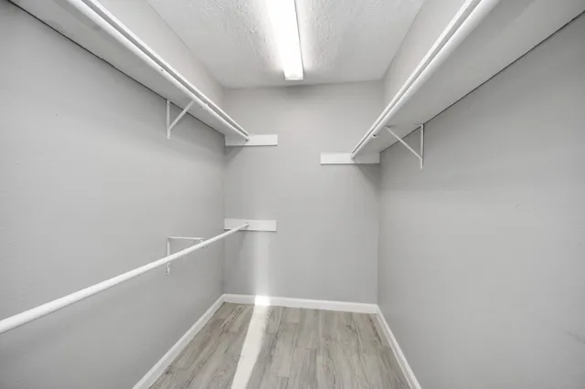 a view of an empty walk in closet