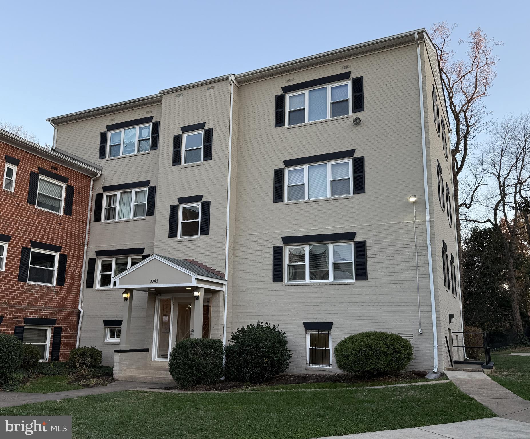 3043 Patrick Henry Drive, Unit 302 Falls Church, VA 22044 - Photo 6 of 7 a view of a yard in front of a house