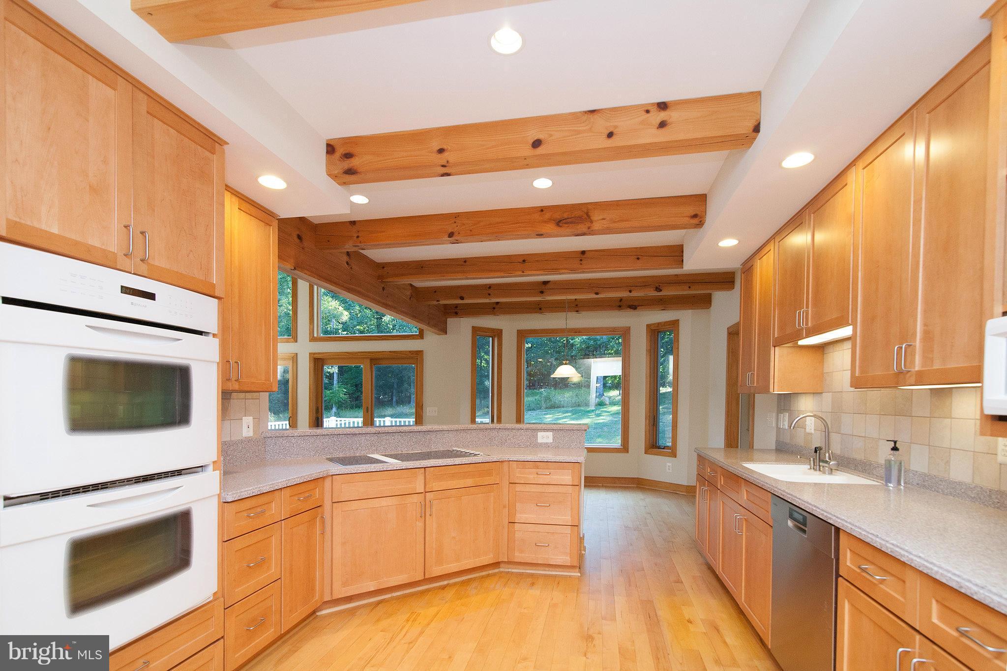 39436 Rodeffer Road Lovettsville, VA 20180 - Photo 6 of 30 Spacious Kitchen with Maple Cabinets and Corian