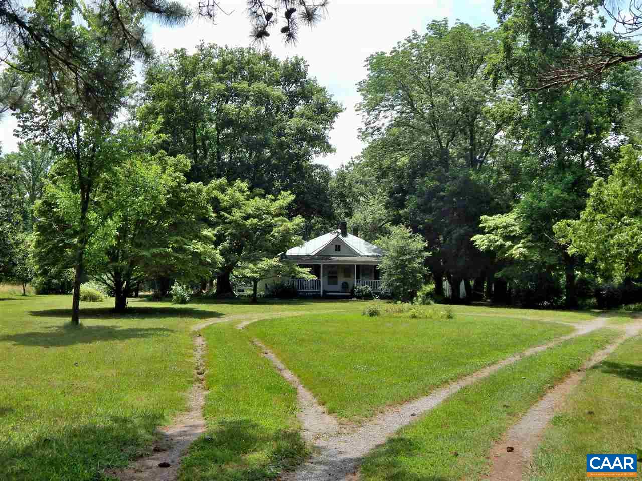 5298 Poindexter Road Louisa, VA 23093 - Photo 19 of 20 a view of a house with a big yard and large trees