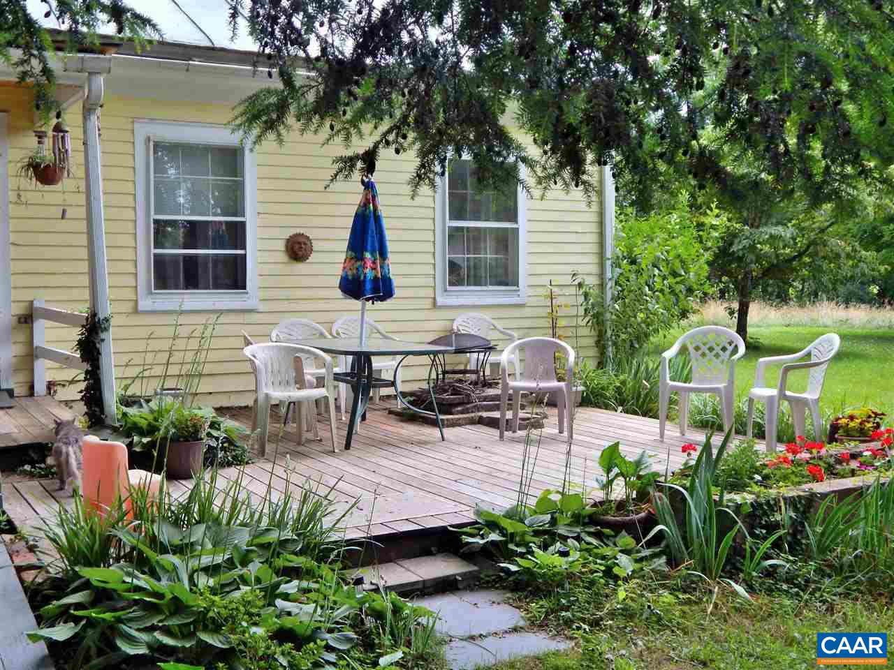 5298 Poindexter Road Louisa, VA 23093 - Photo 5 of 20 a view of a chair and table in backyard of the house