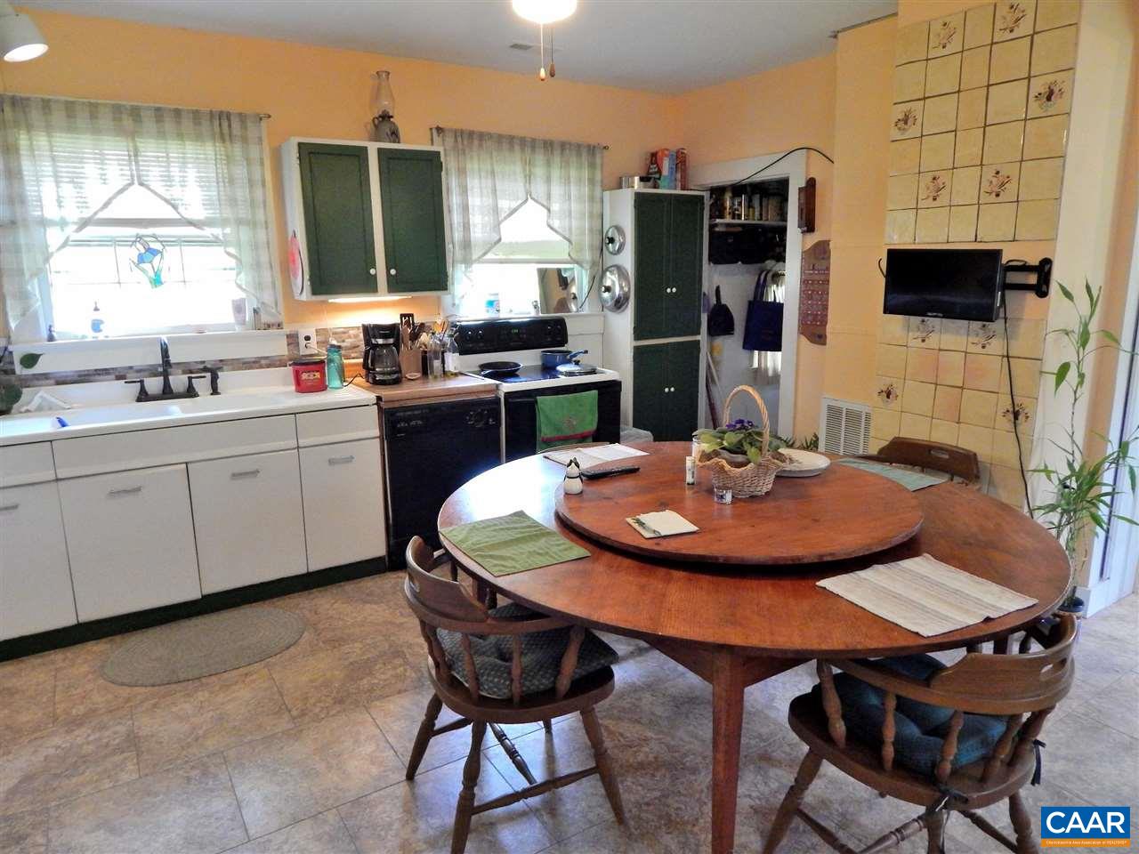 5298 Poindexter Road Louisa, VA 23093 - Photo 10 of 20 a kitchen with a dining table and chairs