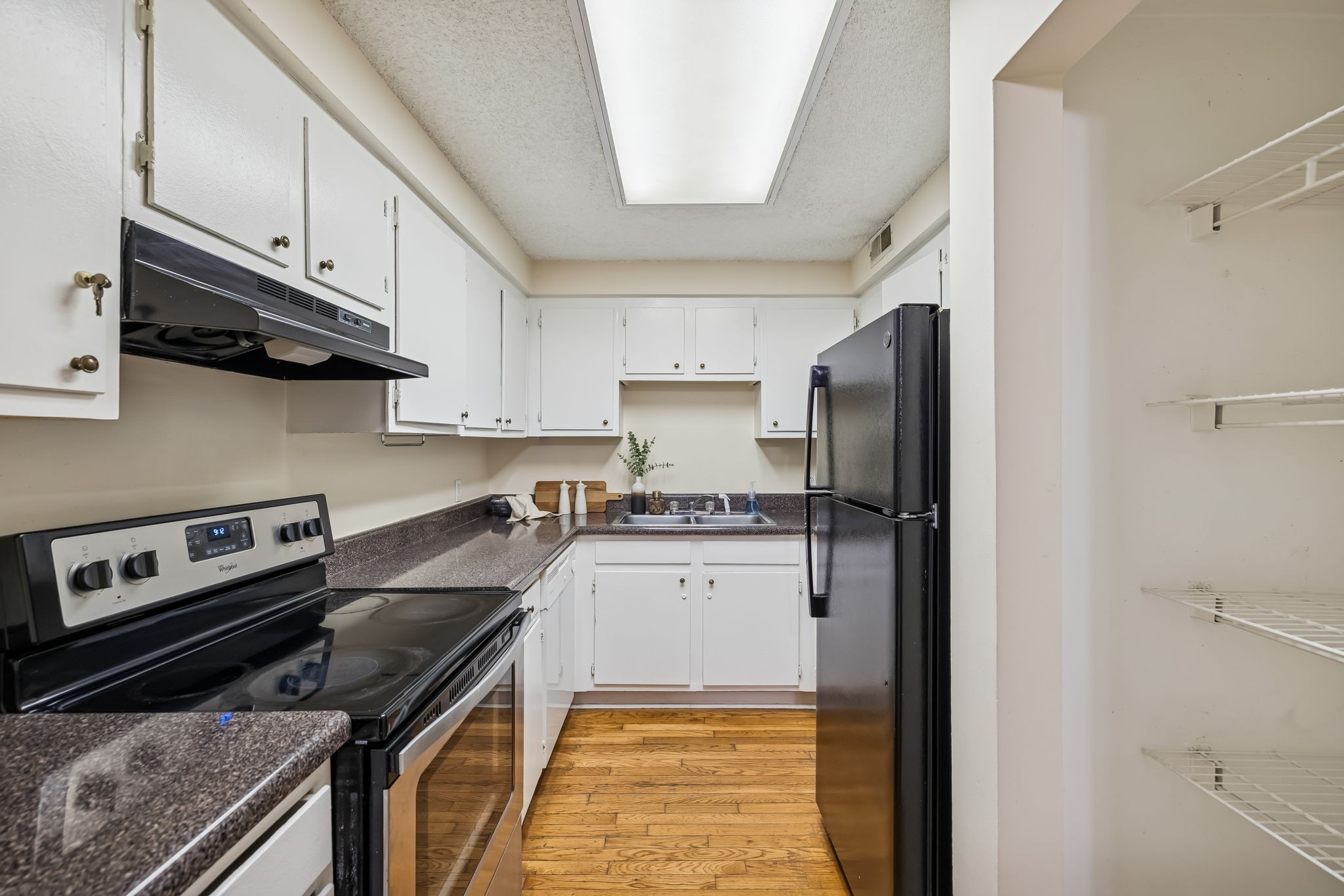 500 Paragon Mills Road, Unit M11 Nashville, TN 37211 - Photo 17 of 31 a kitchen with stainless steel appliances a stove a sink and a refrigerator