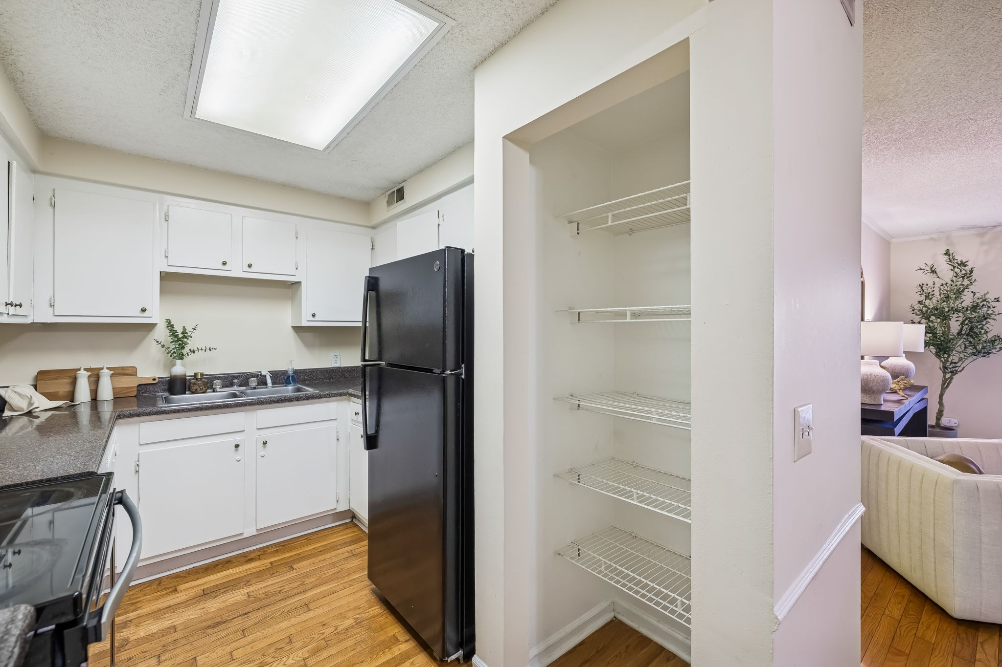 500 Paragon Mills Road, Unit M11 Nashville, TN 37211 - Photo 20 of 31 a kitchen with granite countertop cabinets and refrigerator