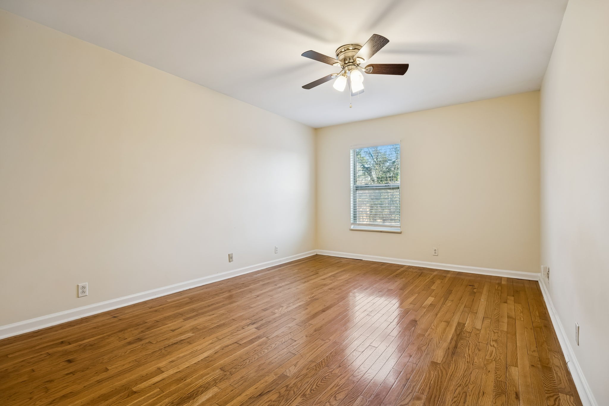 500 Paragon Mills Road, Unit M11 Nashville, TN 37211 - Photo 22 of 31 an empty room with wooden floor and windows