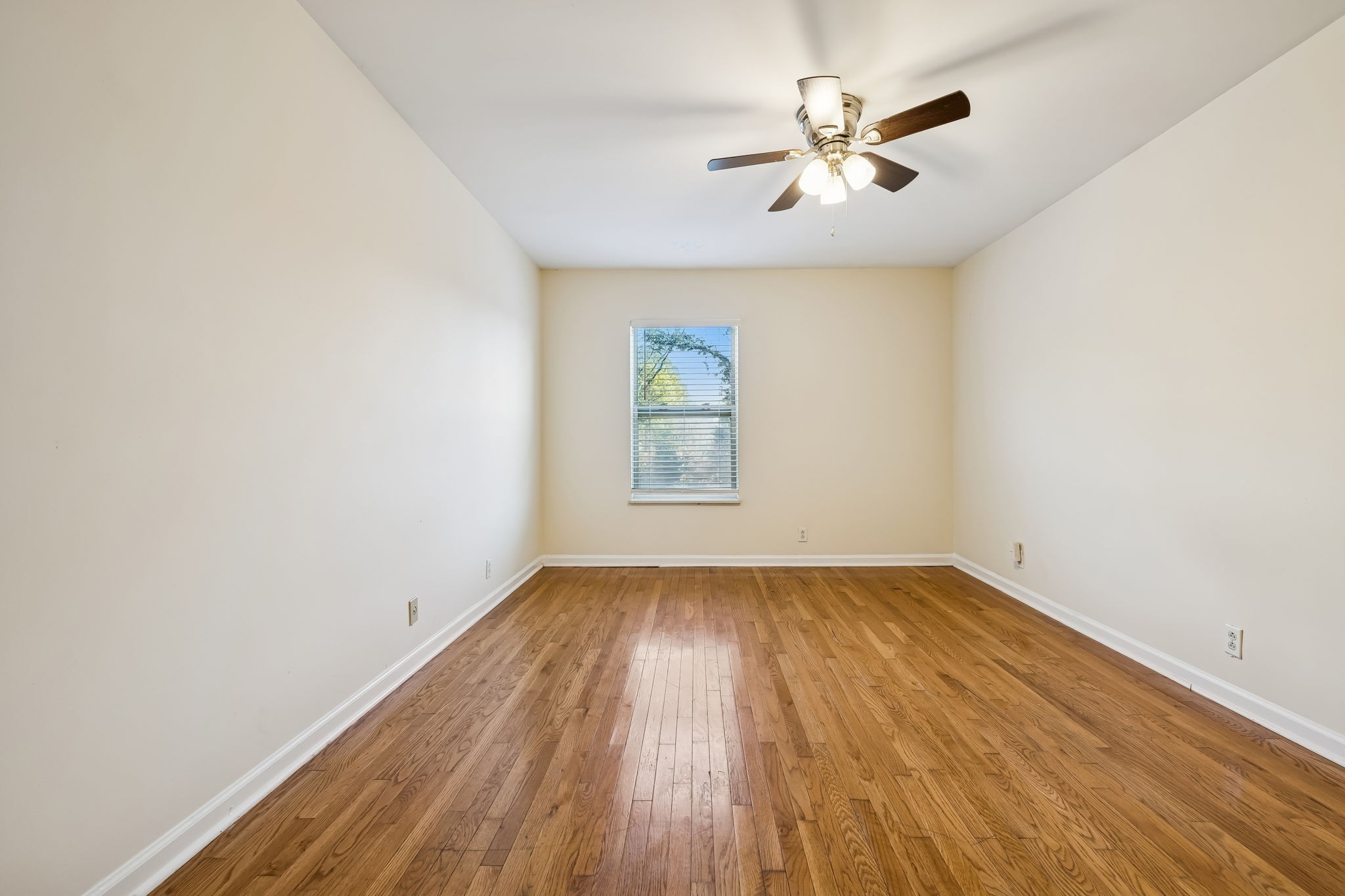 500 Paragon Mills Road, Unit M11 Nashville, TN 37211 - Photo 23 of 31 an empty room with wooden floor and windows