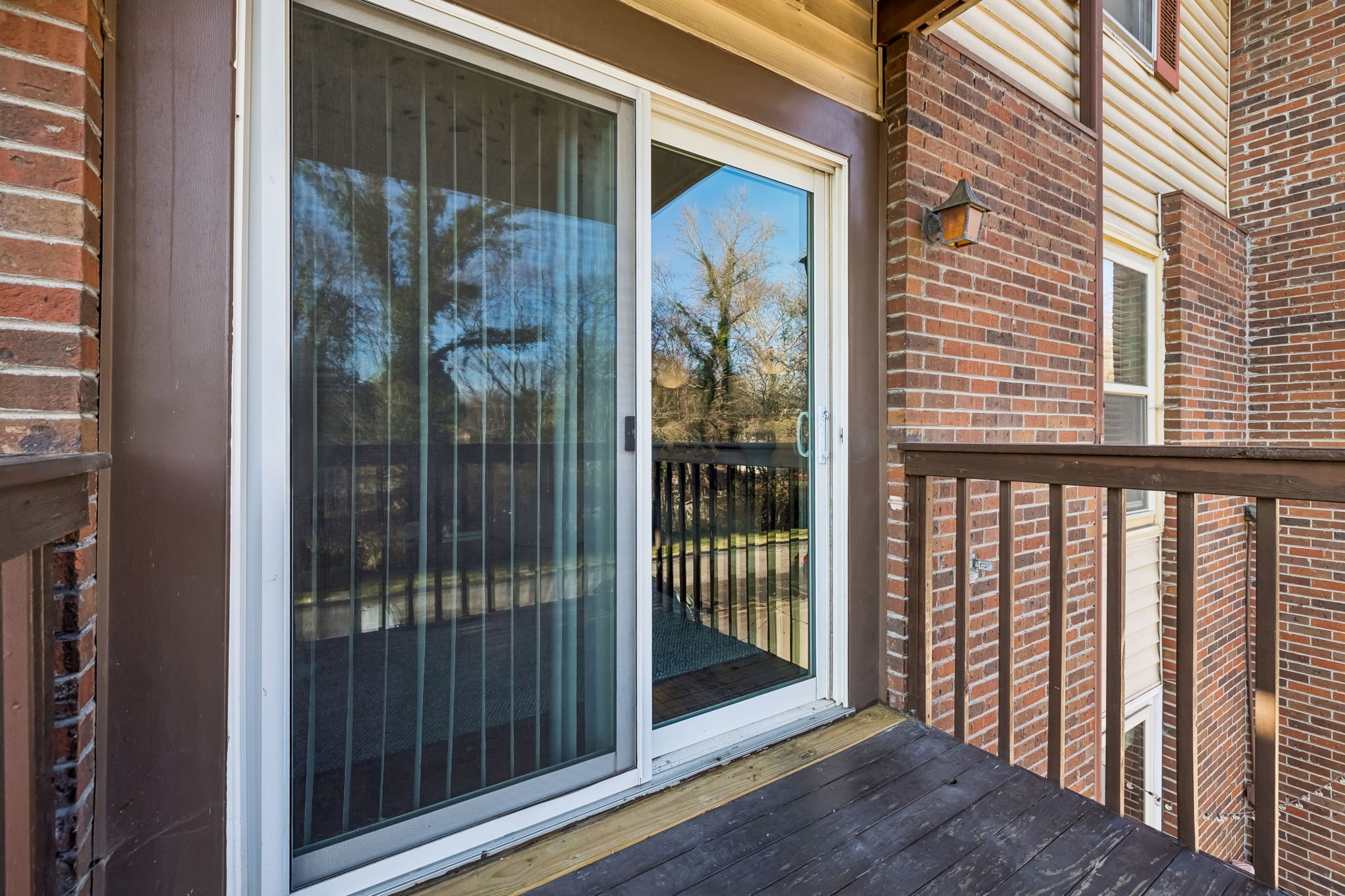 500 Paragon Mills Road, Unit M11 Nashville, TN 37211 - Photo 8 of 31 a view of a balcony with wooden floor