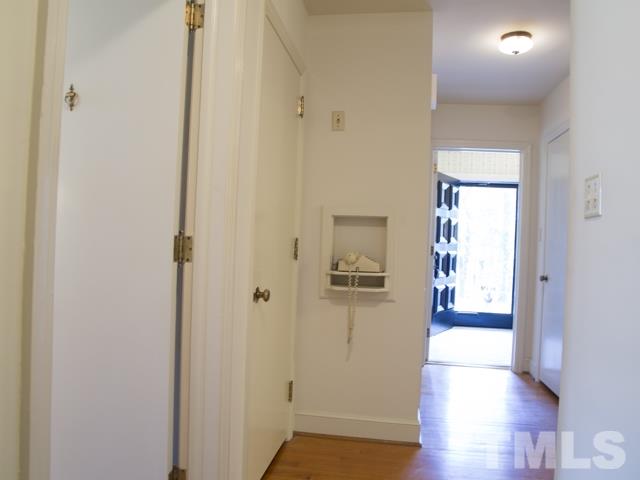 3000 Buckingham Road Durham, NC 27707 - Photo 14 of 25 a view of a hallway with wooden floor
